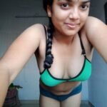 bending down to show cleavage in a bra