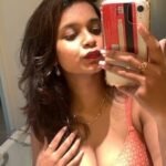 plump boobs pushed up in her bra